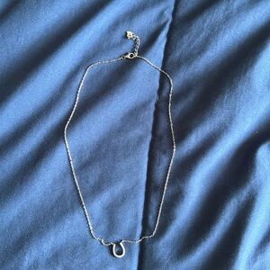 Silver pendant with a horeshoe with diamonds